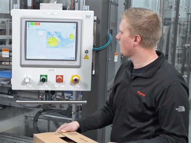 Aagard Controls Engineer using a machine's HMI controls to operate.
