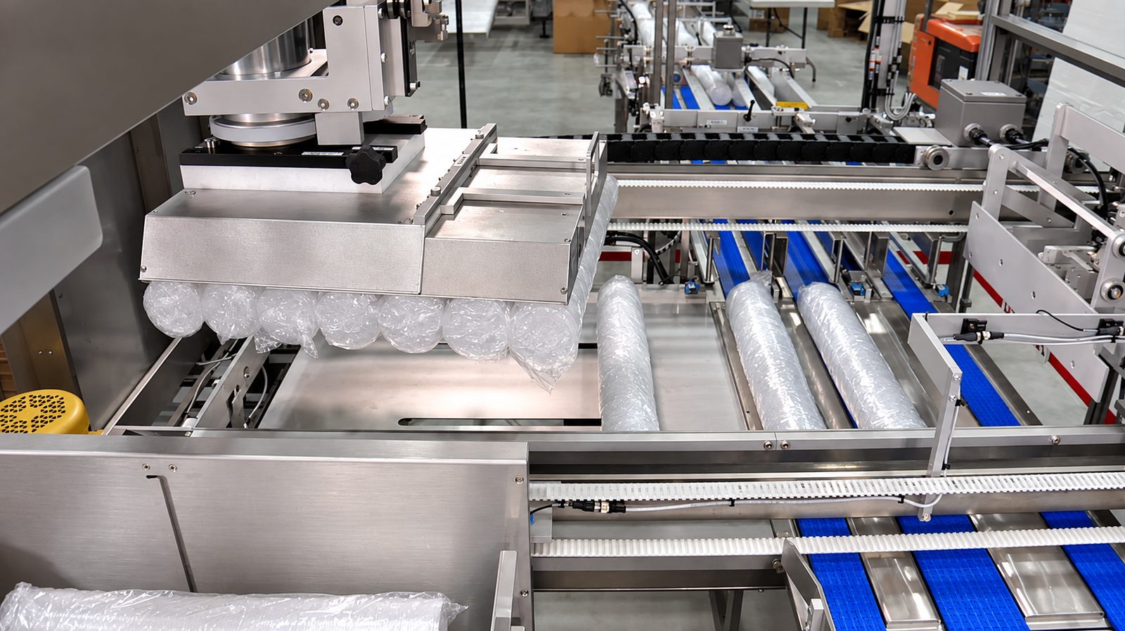 Aagard sleeving, cartoning, case packing and palletizing engineered as one integrated system